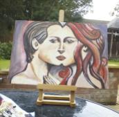 Actress Kacey Barnfield's painted art work of a male and female face meeting in the middle.
