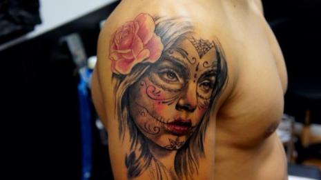 Tattoo of actress on a man's arm.