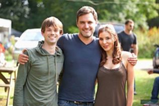 Kacey Barnfield standing with co-star and director